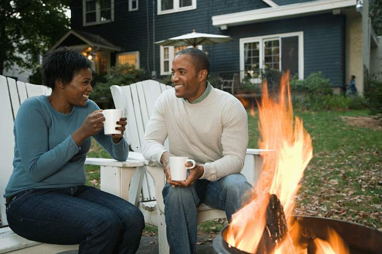 happy homeowners at camp fire. Living in Columbus, Ohio.