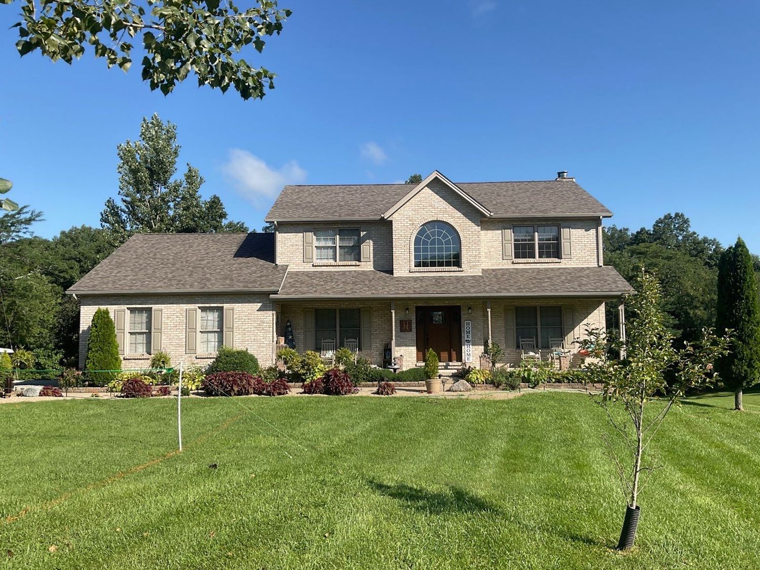 attractive shingle roof on brick home