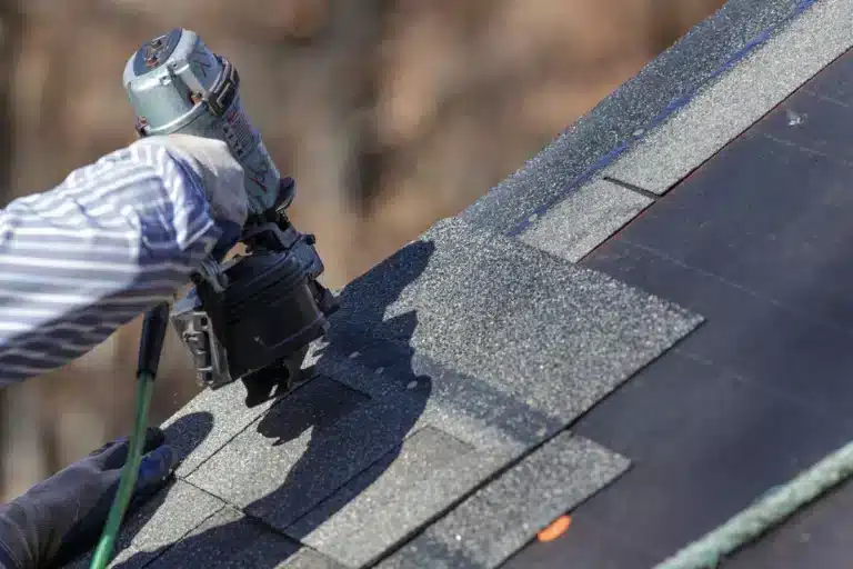 Close up of roofing tools - nail gun used for shingles