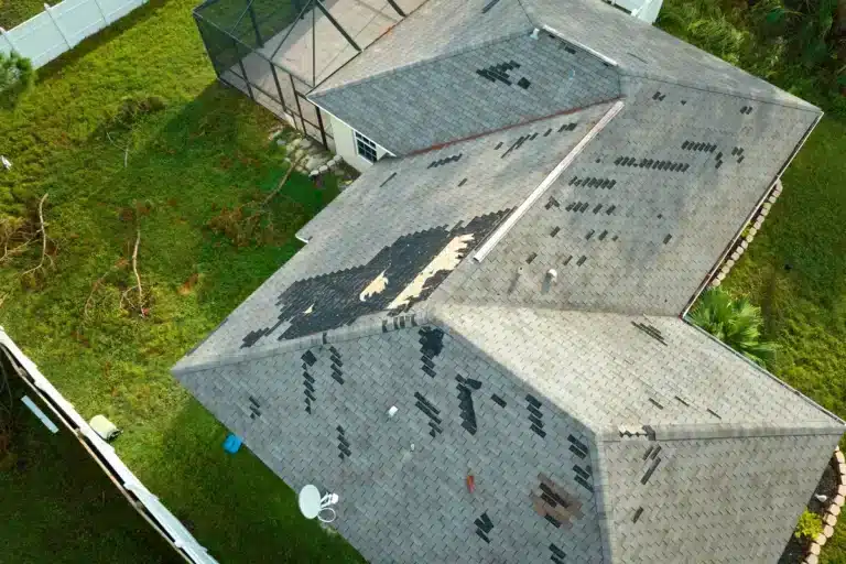 drone view of storm damage signs on rooftop