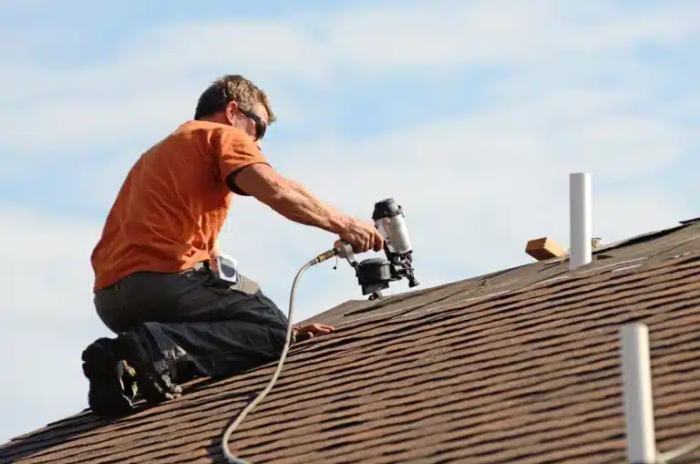 contractor shows how to remove shingles and replace them