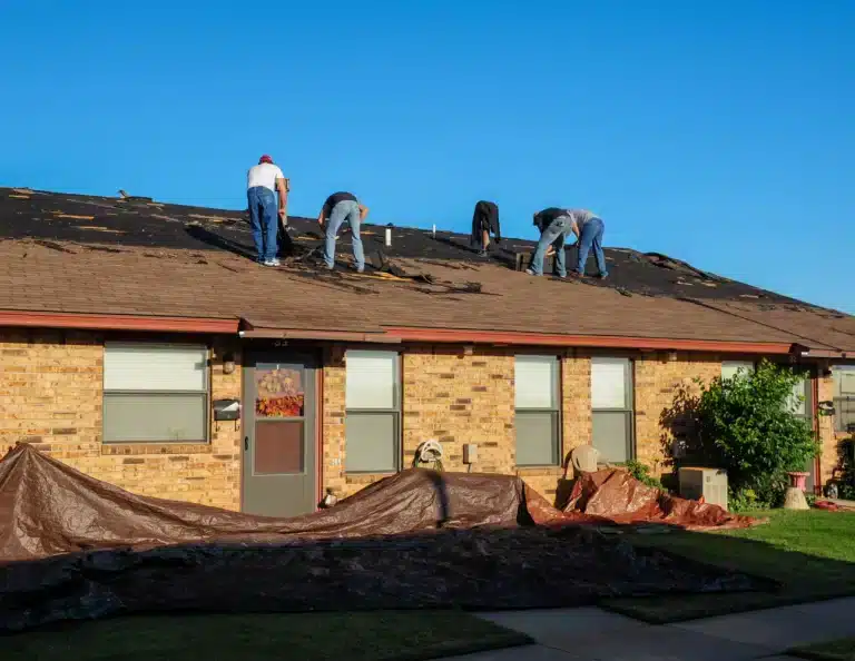 house roof replacement by construction crew