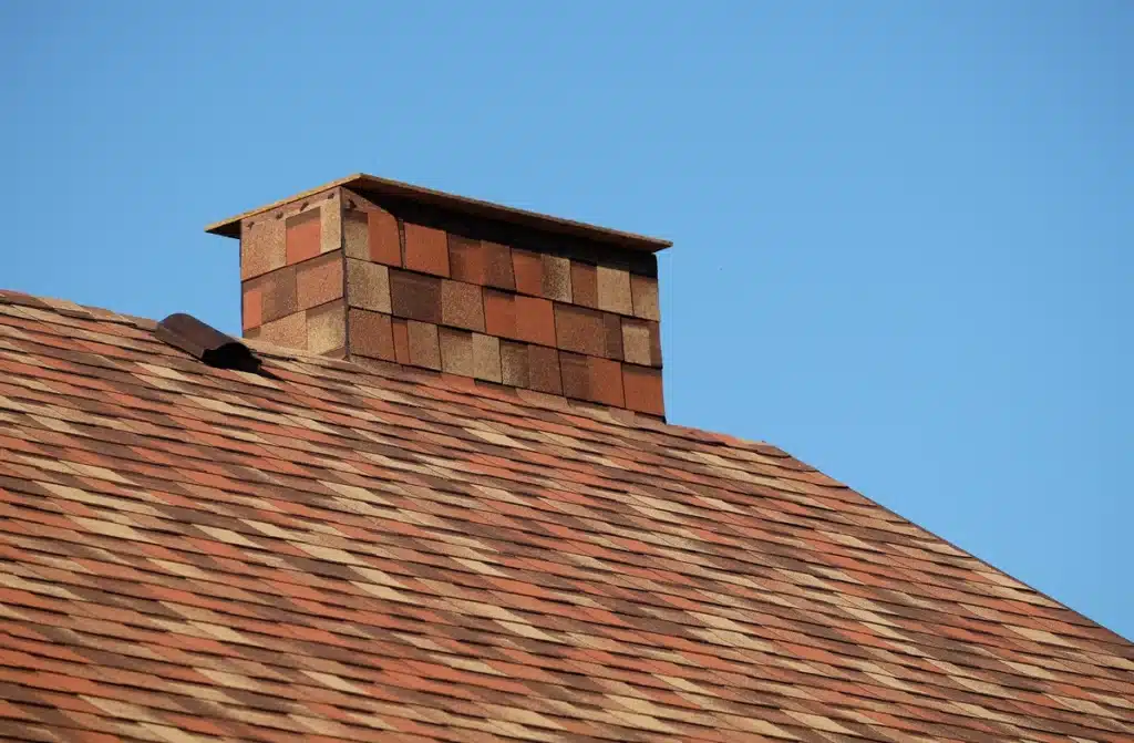 Close up view of Sedona Canyon Owens Corning Shingle Colors on roof and chimney