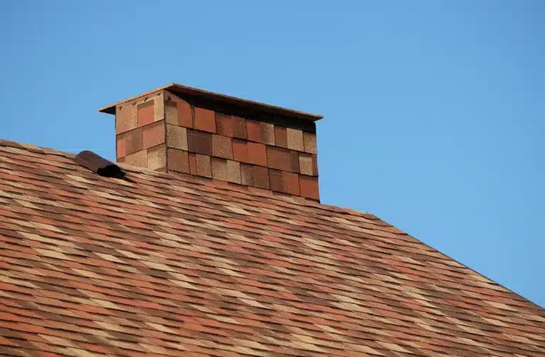 Close up view of Sedona Canyon Owens Corning Shingle Colors on roof and chimney