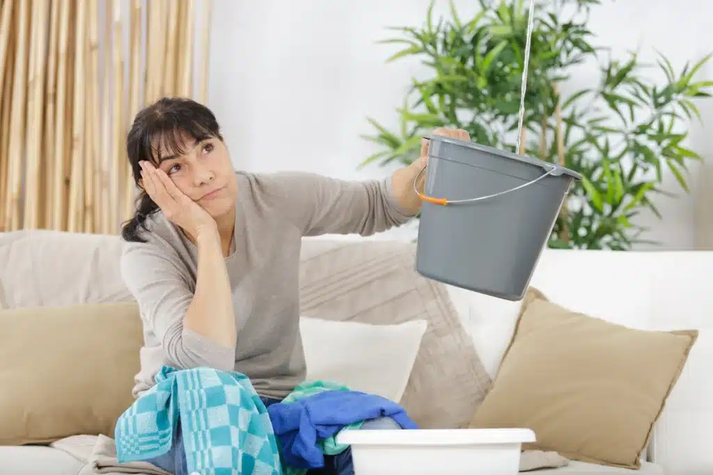 homeowner with leaking ceiling-Roof leak repair cost