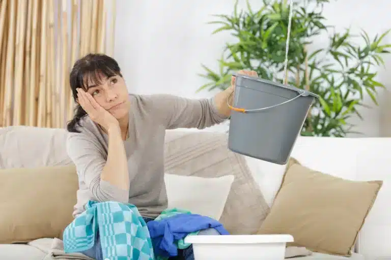 homeowner with leaking ceiling-Roof leak repair cost