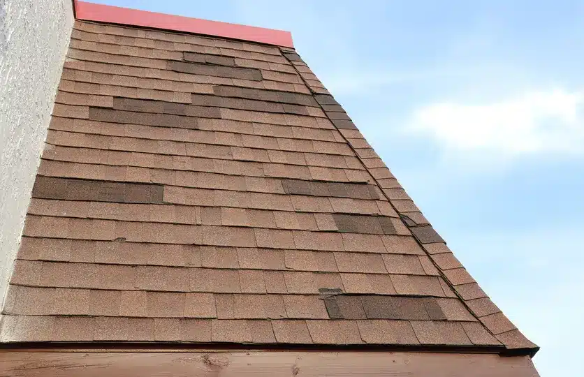 Damaged shingle roof in Belbrook